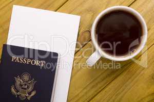 Documents for travel and a cup of coffee