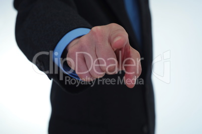 Businessman pointing finger at you