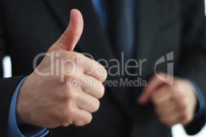 Giving thumbs up sign