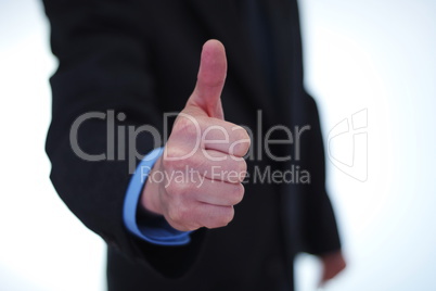 Giving thumbs up sign