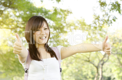 Asian college student thumb up