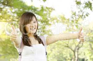 Asian college student thumb up