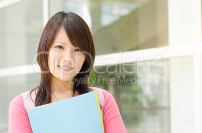 Young Asian college student at school campus