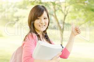 Asian college girl student showing thumb up