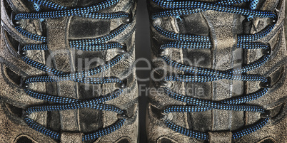 lacing a pair of old sneakers closeup