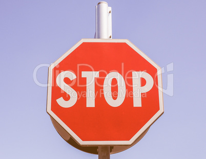 Stop sign over blue sky vintage