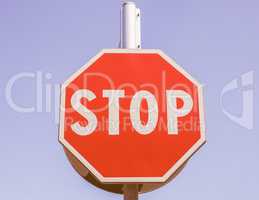 Stop sign over blue sky vintage