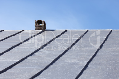 Chimney on an old tinny roof