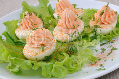 Eggs stuffed with salmon pate in lettuce leaves