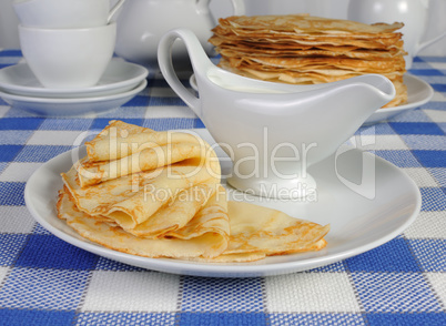 pancakes on a plate with milk sauce