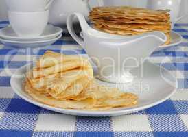 pancakes on a plate with milk sauce