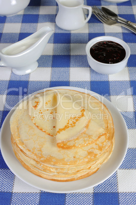 pancakes on a plate with milk sauce