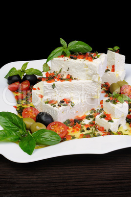 Feta cheese in oil with basil