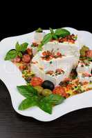Feta cheese in oil with basil