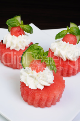 Appetizer of watermelon with ricotta