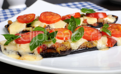 Baked eggplant with tomato and basil and cheese