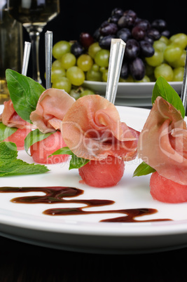 Canape of watermelon balls with gammon