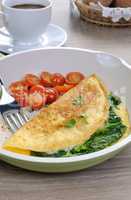 Omelet with spinach, cheese and roasted tomatoes