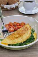 Omelet with spinach and roasted tomatoes