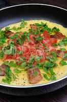Omelet  bacon slices, tomatoes with herbs