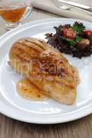 chicken grilled with a salad on a plate