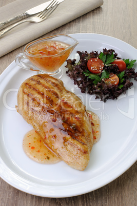 chicken grilled with a salad on a plate