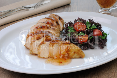 Slices of chicken fillet with sauce