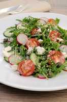 Salad with arugula and vegetables