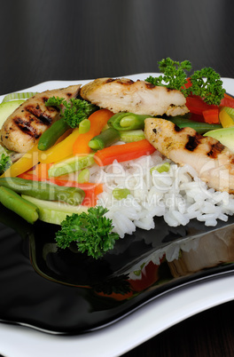 Rice with slices of chicken breast