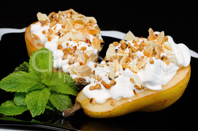 Pear with whipped cream and nuts
