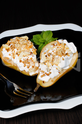 Pear with whipped cream and nuts