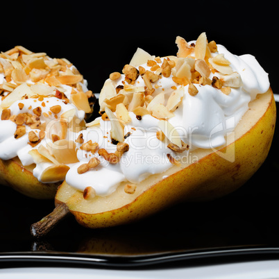 Pear with whipped cream and nuts