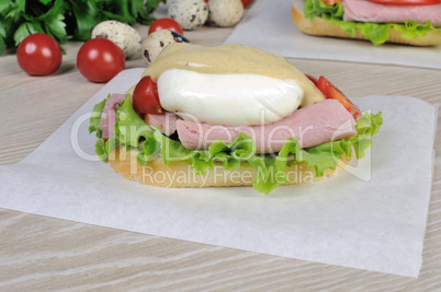 Sandwich with ham and poached egg.