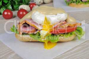 Sandwich with ham and poached egg.