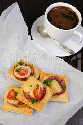 Appetizer of puff pastry with salami