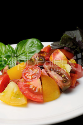 slices of different varieties of tomato