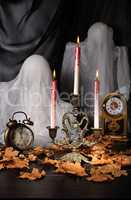 Candles among the fallen leaves