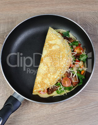 Omelette with vegetables and cheese