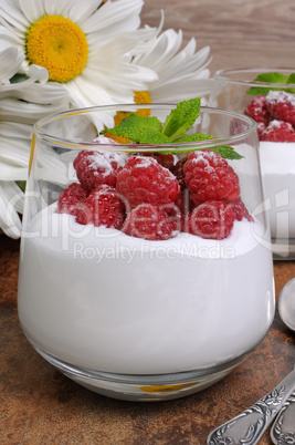 Dessert with whipped cream and raspberries