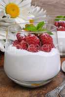 Dessert with whipped cream and raspberries