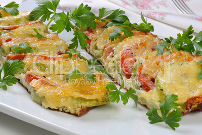 Baked zucchini with tomatoes and cheese