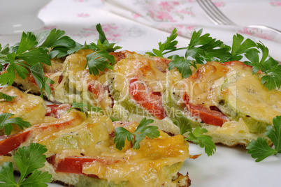 Baked zucchini with tomatoes and cheese