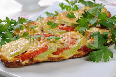 Baked zucchini with tomatoes and cheese