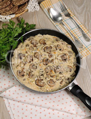 Fried mushrooms in a creamy sauce