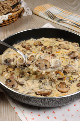 Fried mushrooms in a creamy sauce