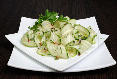 Salad from fresh cucumbers with garlic, dill, spices