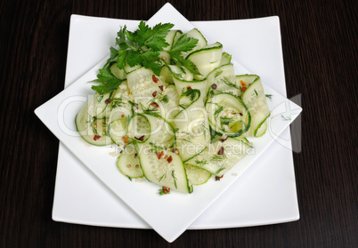 Salad from fresh cucumbers with garlic, dill, spices