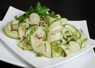Salad from fresh cucumbers with garlic, dill, spices