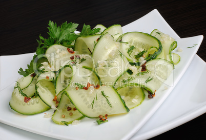 Salad from fresh cucumbers with garlic, dill, spices