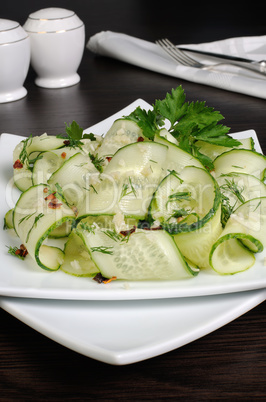 Salad from fresh cucumbers with garlic, dill, spices